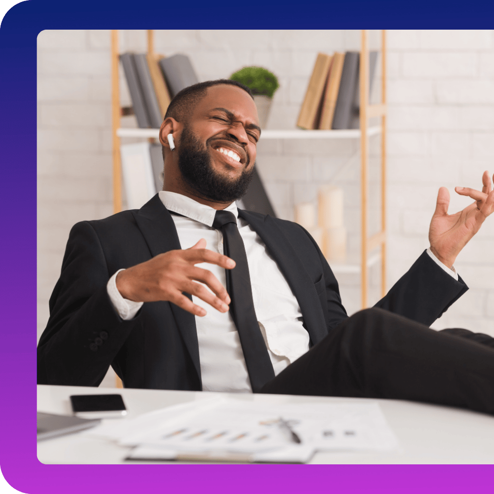 Happy office guy relaxing after uploading new file to a flow and not having to do the manual work again - pretends to play a guitar